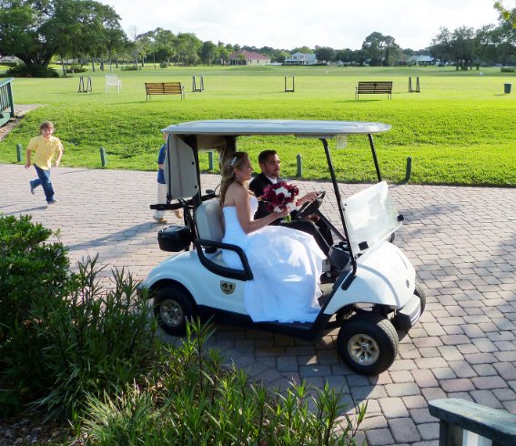 The bride and groom get in nine holes befoe the reception